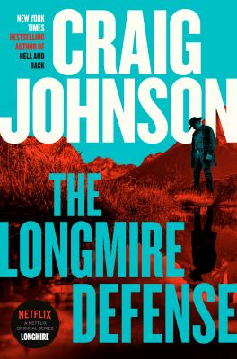 Cover of The Longmire Defense: Cowboy standing in front of the mountains